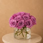 Pink roses arranged in a clear glass vase