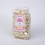 Bag of white cheddar popcorn with a colorful label