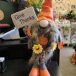 Fall gnome figurine holding a "Give Thanks" sign