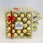 Boxes of Ferrero Rocher chocolates tied with a red ribbon