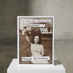 Birthday card with a woman holding up a wine glass and text saying Happy Birthday