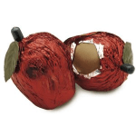 Two red decorative apple ornaments with leaves and stems