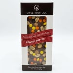 Boxed peanut butter chocolate bar with candy pieces