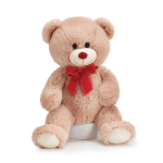 Plush teddy bear with a red bow sitting on a white base