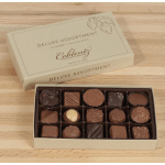 Box of assorted chocolates with the lid open on a wooden surface