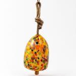 Colorful speckled hanging bell ornament with a rope loop
