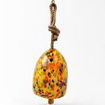 Colorful speckled hanging bell ornament with a rope loop