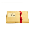 Gold Godiva chocolate gift box tied with a red ribbon