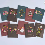 Assorted floral greeting cards with colorful paper-cut designs