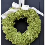 Green hydrangea wreath with a white ribbon bow