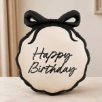 Black-and-white birthday balloon with a bow shape and script text