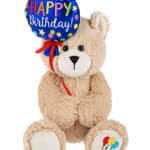 Teddy bear holding a Happy Birthday balloon