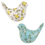 Two decorative bird figurines with floral patterns, one white and one blue
