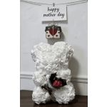 White teddy bear with a small rose bouquet and a "happy mother day" sign