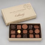 Box of assorted chocolates with the lid open beside it