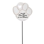White paw-print memorial stake with heart cutout and text