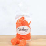 Bag of orange slice candies tied with a white ribbon