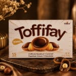 Box of Toffifay chocolates on a dark surface