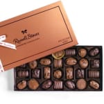 Box of assorted chocolates with the lid partially open