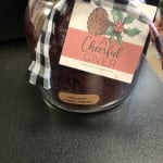 Holiday gift jar with plaid ribbon and a Cheerful Giver label