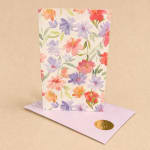 Floral greeting card with pastel flowers and a matching envelope
