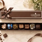 Box of assorted chocolates with a ribbon bow