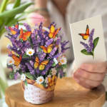 Basket of purple flowers with butterfly decorations and a matching card