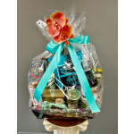 Gift basket wrapped in clear cellophane with a turquoise ribbon and orchid topper