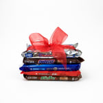 Stack of assorted candy bars tied with a red ribbon