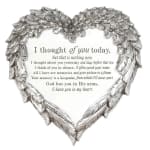 Heart-shaped silver memorial plaque with a condolence message