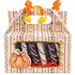 Decorative gift box with chocolate-covered treats and ribbon handles