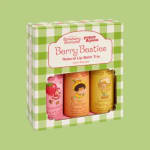 Boxed trio of berry-themed lip balms in pink, orange, and yellow packaging
