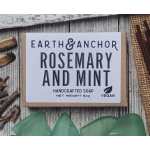 Bar of rosemary and mint soap in a kraft paper box