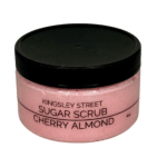 Pink sugar scrub jar with a black lid