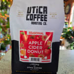 Bag of Utica Coffee apple cider donut coffee on a counter