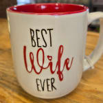 White ceramic mug with red interior and "Best Wife Ever" text