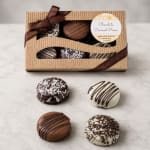 Box of assorted chocolate-covered sandwich cookies with ribbon