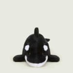 Black and white orca plush toy on a plain background