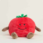 Plush tomato-shaped toy with a smiling face and small limbs