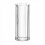 Tall clear ribbed glass vase on a white background