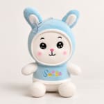 Blue plush bunny toy with a smiling face and the word Smile on its shirt