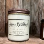 Birthday soy wax candle in a glass jar with a brown lid