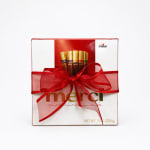 Box of assorted chocolates tied with a red ribbon