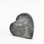 Heart-shaped memorial sign with a tree and remembrance text