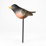 Decorative bird pick with a black and orange bird on a stick