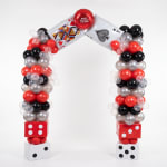 Balloon arch with playing card balloons and dice blocks