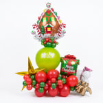 Christmas balloon arrangement with a gingerbread house topper and gift balloon