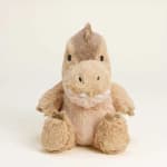 Plush dinosaur stuffed animal sitting on a plain light background