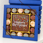Box of assorted chocolates with a Happy Birthday card