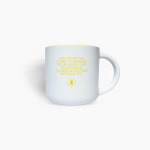 White mug with yellow text and a small logo